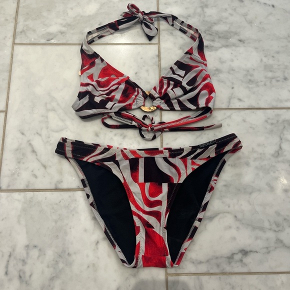 Ulu Red and Black Patterned Bikini. Has a stain on the top. - Picture 1 of 5